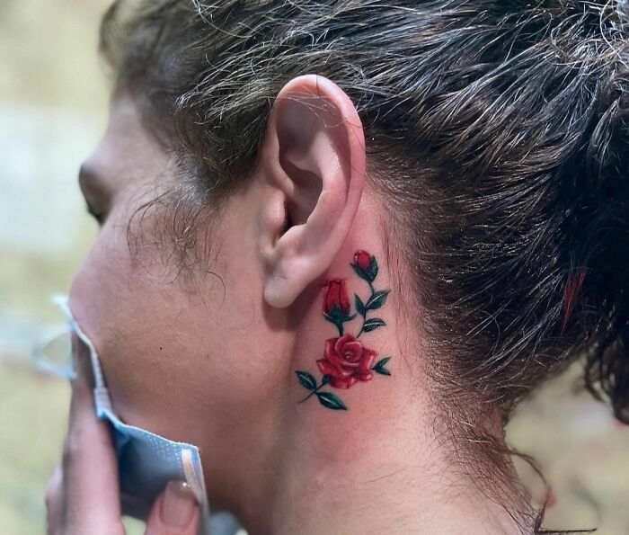 ear tattoo of rose flowers