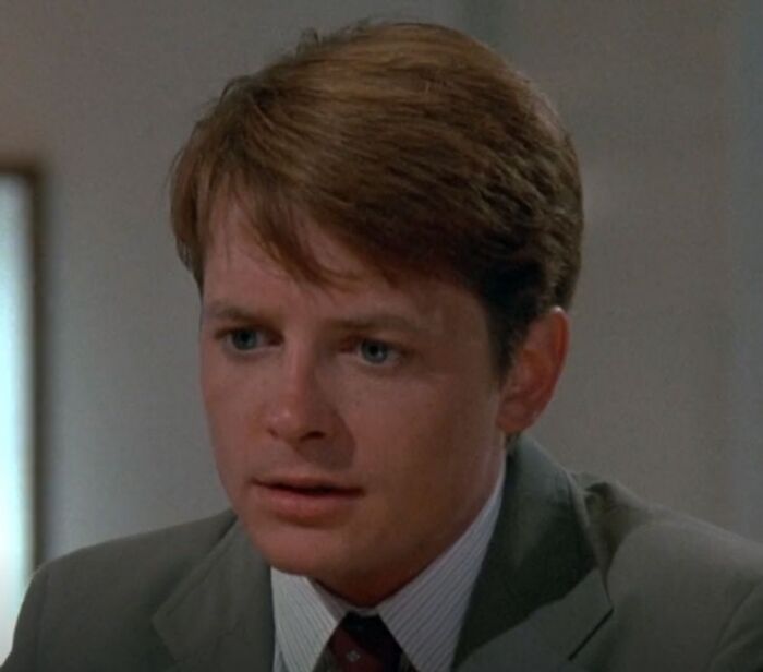 Michael J. Fox looking in movie The Secret Of My Success
