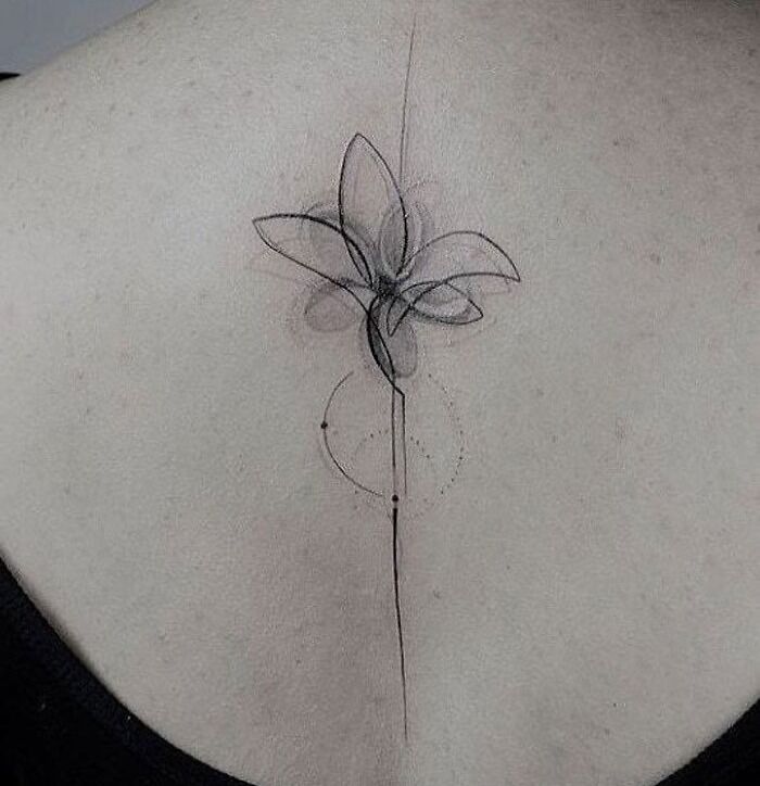 Delicate floral back tattoo