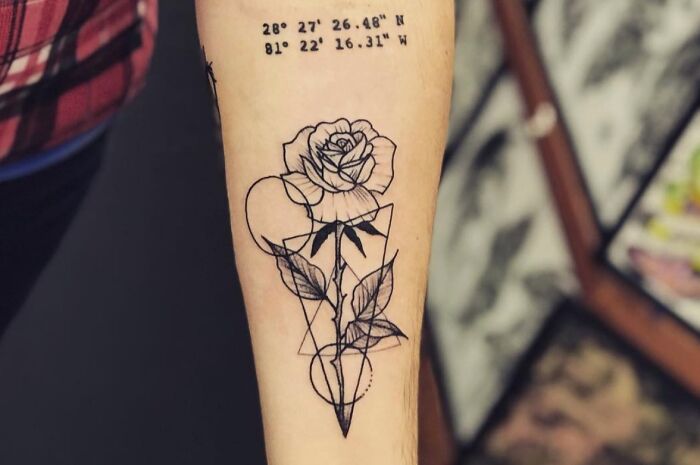 Geometric tattoo design featuring a rose with shapes and forms on the forearm, showcasing creativity in ink art.