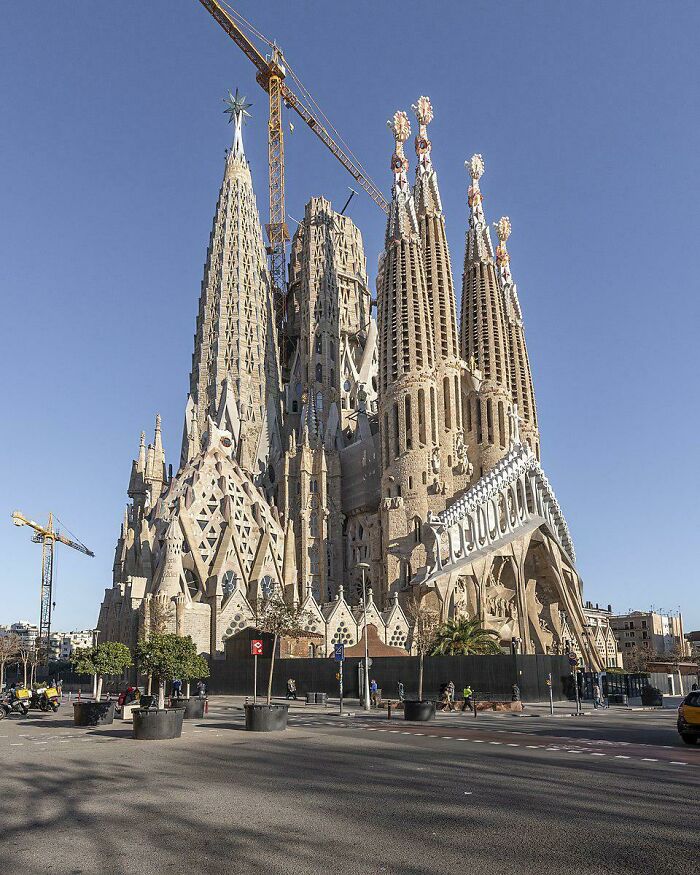 The Basílica De La Sagrada Família In Barcelona, Spain, Begun In 1882 By The Catalan Architect Antoni Gaudí, And Is Still Under Construction Today (Photo 2021)