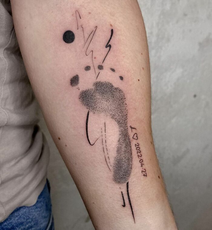 Footprint tattoo on arm