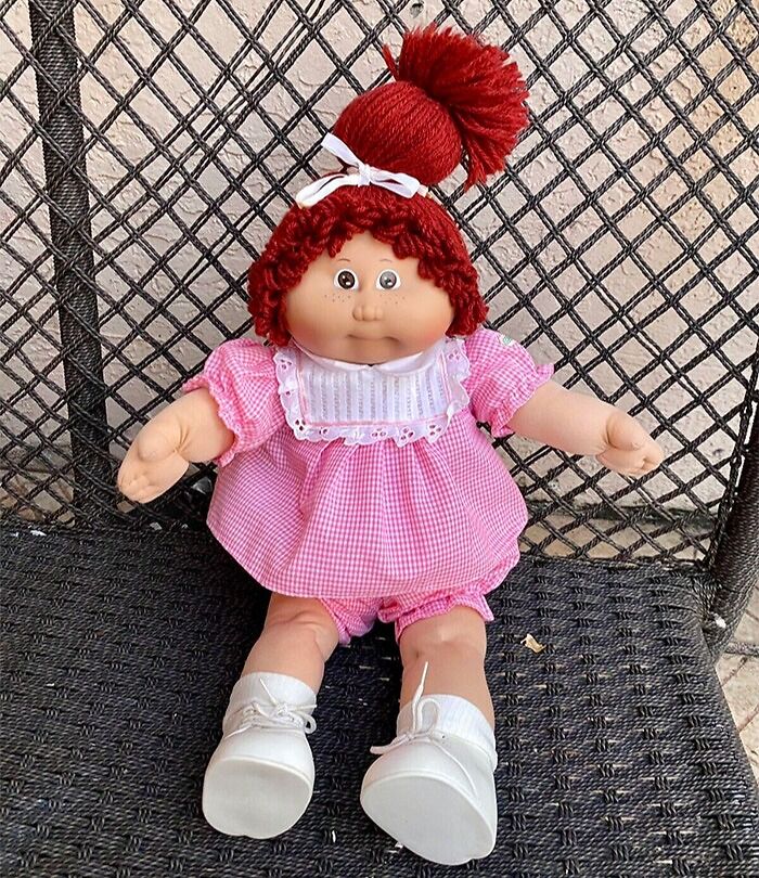 Cabbage Patch Kids doll sitting in the chair
