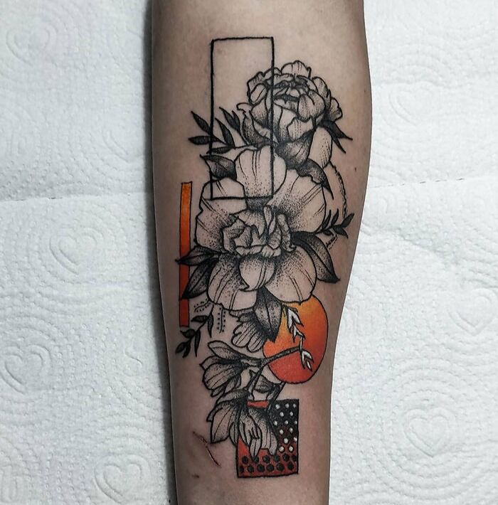 Black flowers and geometric shapes tattoo