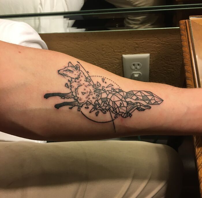 Half geometric fox tattoo on arm