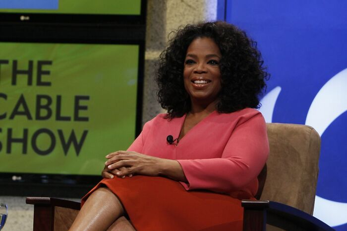 Oprah Winfrey sitting in the chair 
