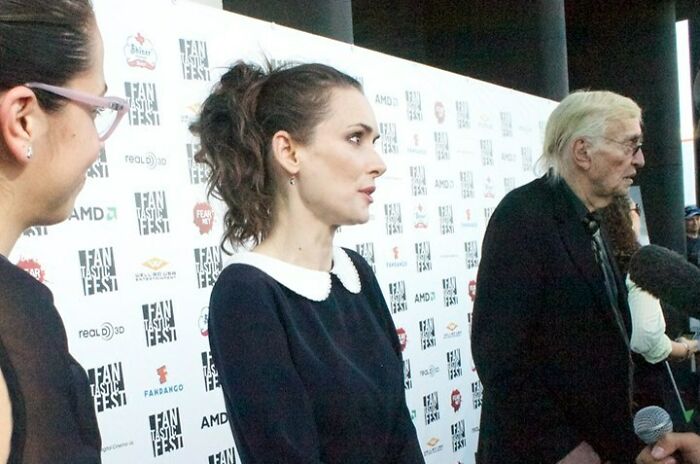Winona Ryder in a black dress at an event, featured among celebrities who never married yet found love.
