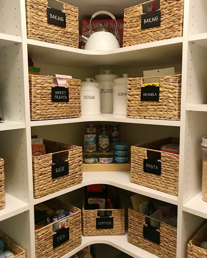 Woven baskets and labeled jars on pantry shelves exemplify effective home organization ideas.