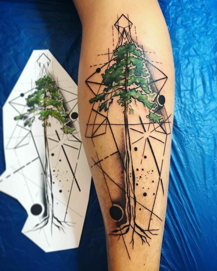 Geometric tattoo of a tree with intricate lines and shapes on a person's leg, showcasing creative artistry.