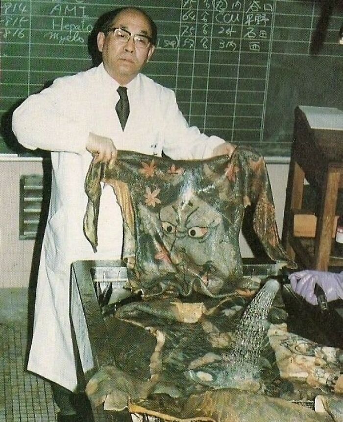 1983. Dr. Fukushi Katsunari With A Wet Specimen From The Preserved Japanese Skin Tattoo Collection At Medical Pathology Museum Of Tokyo University