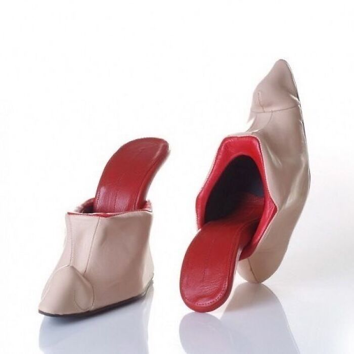 Weird shoes featuring a unique design with beige exterior and red interior, resembling an open mouth with a tongue.