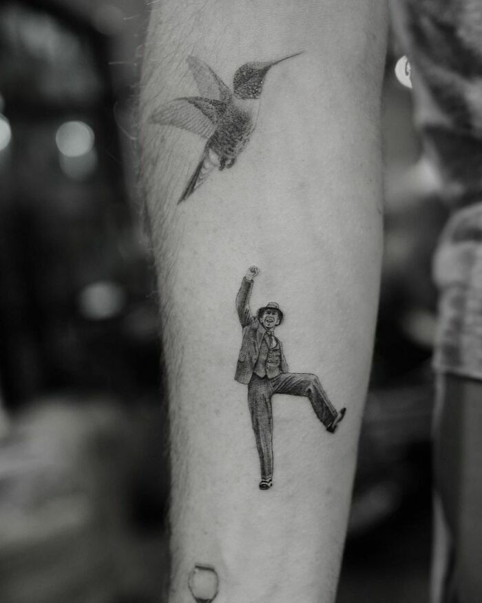 Celebrity tattoos featuring a detailed hummingbird and a dancing figure on a Zach Braff's forearm.