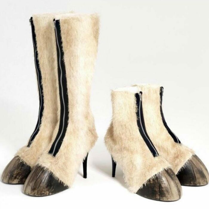 Furry high-heeled boots with hooves, showcasing weird shoes with a zipper detail.