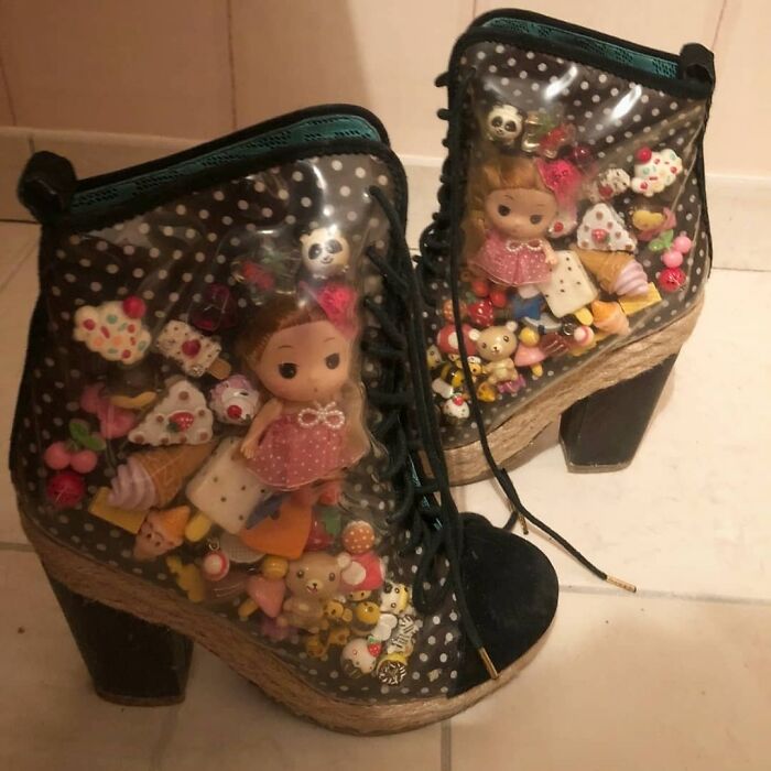 Weird shoes with transparent sides containing dolls, ice cream, and colorful decorations.