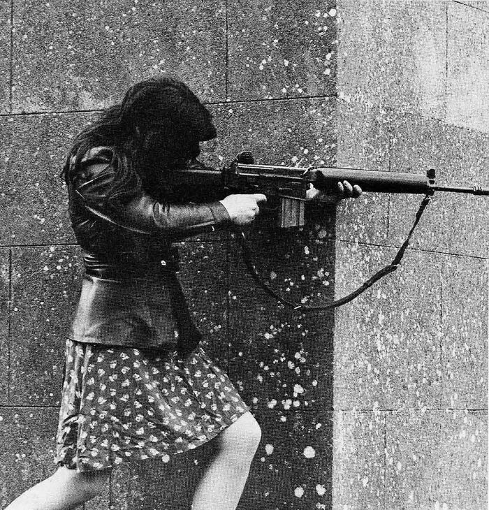 1970s. Female Ira Fighter In West Belfast With An Ar18 Assault Rifle. Photo By Colman Doyle