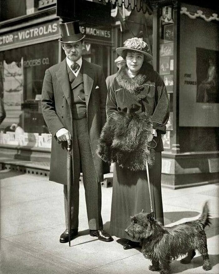 Stylish Edwardian Couple Taking Their Pup For A Walk In New York Circa 1900s