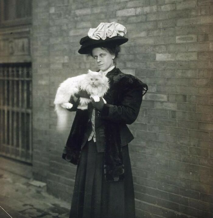 Unidentified Woman Standing Outside With Her Cat In Her Arms, Ca. 1905-1910. Photographer: Jessie Tarbox Beals