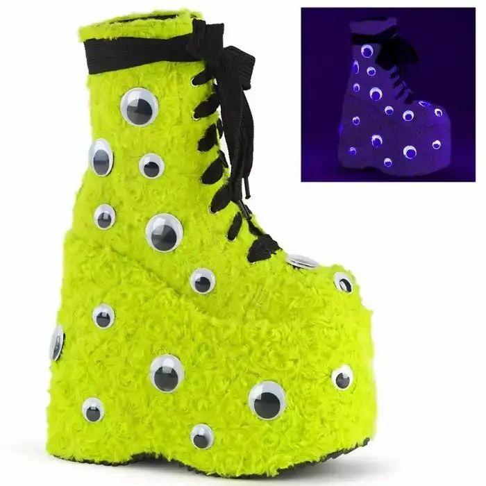 Bright yellow furry platform shoe with googly eyes, a unique footwear design.