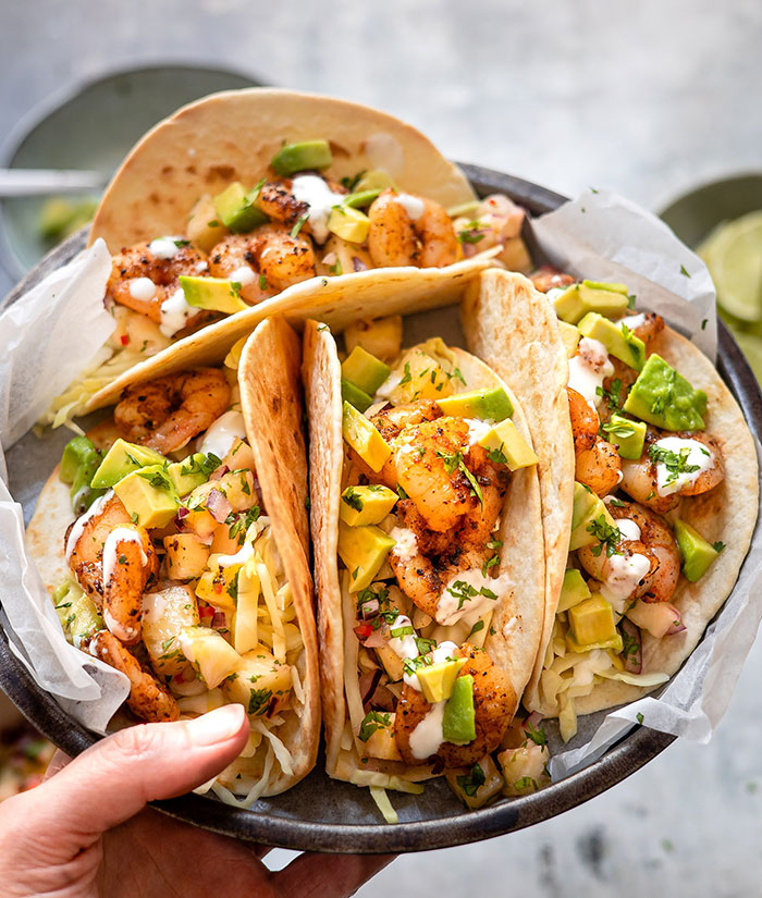 Multiple colorful tacos on a plate 
