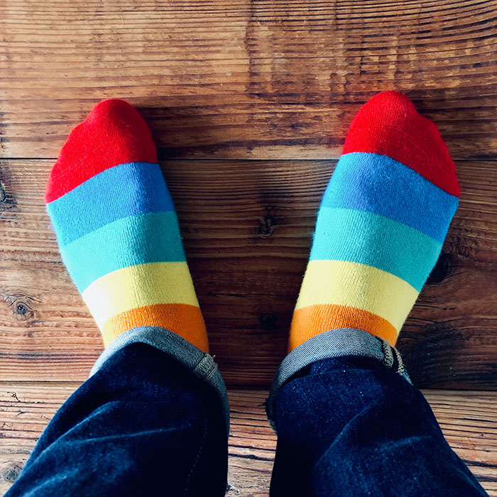 Man wearing colorful socks 