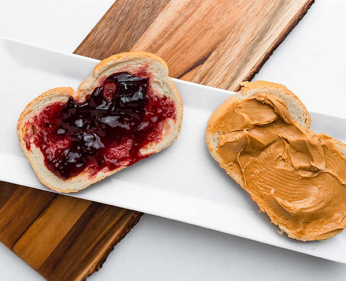 Peanut butter an jelly on a piece of bread 