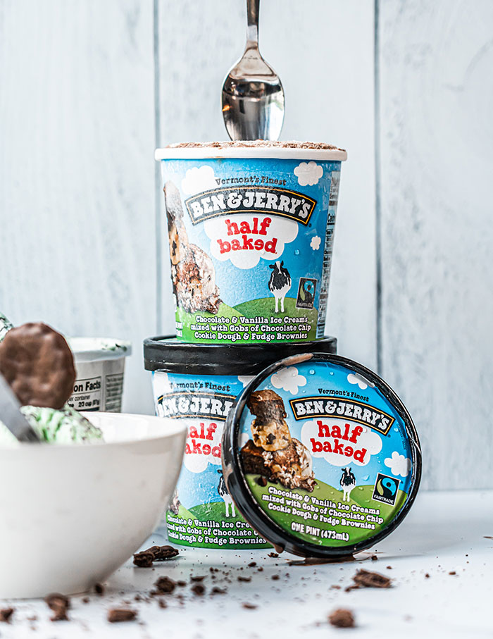 Multiple Ben And Jerry containers and spoon 