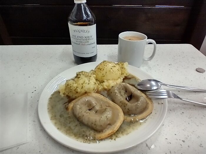 Pie, Mash, And Liquor. Pies Turned Upside Down To Soften The Crusts. Plenty Of Chilli Vinegar