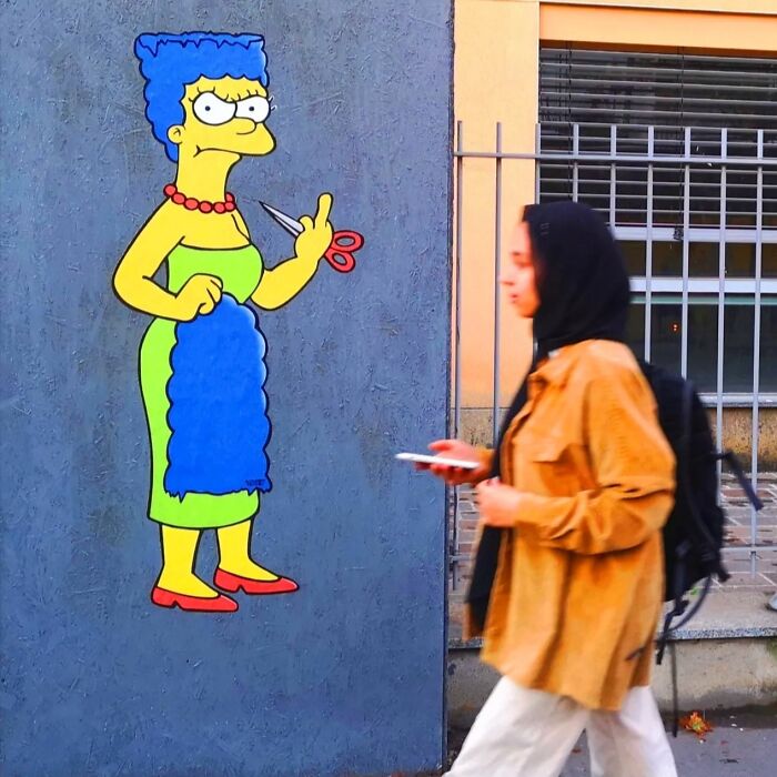 Behind “The Cut” Story Mural Featuring Marge Simpson Supporting The Iranian Protests Which Was Censored In Milan Italy