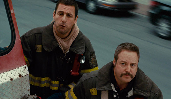 Adam Sandler and Kevin James wearing firefighter clothes in movie I Now Pronounce You Chuck & Larry