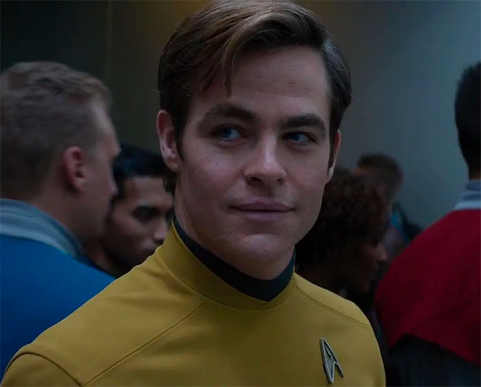 Chris Pine wearing yellow clothes looking from movie Star Trek Beyond 
