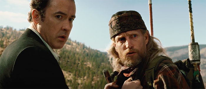 John Cusack and Woody Harrelson looking in movie 2012