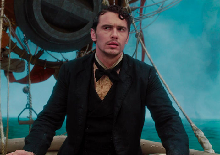 James Franco wearing suit and looking in movie Oz The Great And Powerful