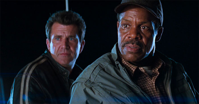 Mel Gibson and Danny Glover looking in movie Lethal Weapon 4