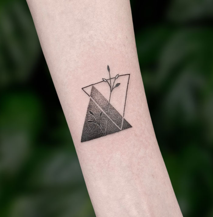 Triangles and delicate flower tattoo