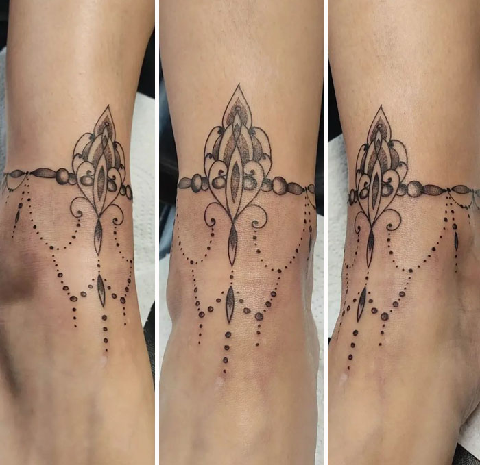 Geometric tattoo design on ankle, showcasing intricate shapes and forms creatively.