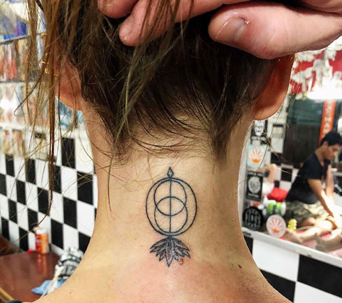 Geometric with circles and arrow back neck tattoo