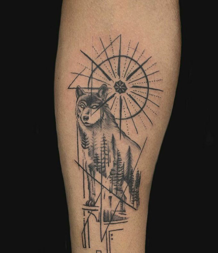 Wolf, pine trees and geometric sun tattoo