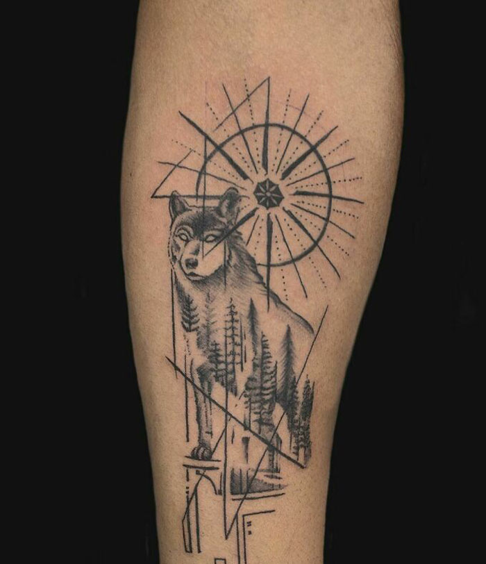 Wolf geometric tattoo design featuring shapes and forms on an arm, showcasing creativity.