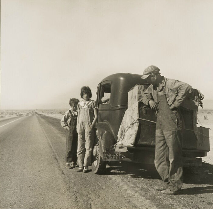 Oklahoma Sharecropper And Family Entering California. Stalled On The Desert Near Idaho, Ca. 1937