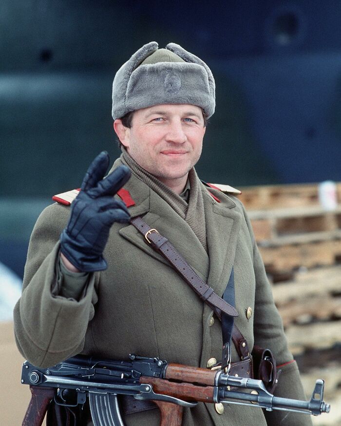 A Romanian Sub-Officer Gives The Victory Sign On New Year's Eve 1989 In The Aftermath Of The Revolution. He Has Removed The Insignia Of Communist Romania From His Ushanka. And No, It’s Not Philip Jennings From The Americans
