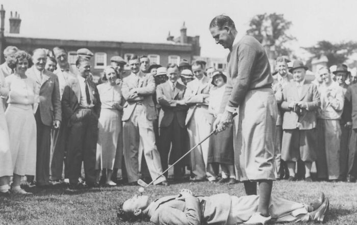 Australian Golfer Joe Kirkwood Teeing Off From A Caddy's Mouth In 1930