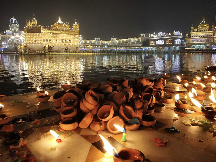 Diyas lit for Diwali at Golden Temple, Punjab