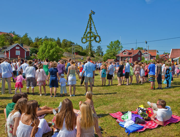 Crowd of people at Midsummer in Sweden at daytime