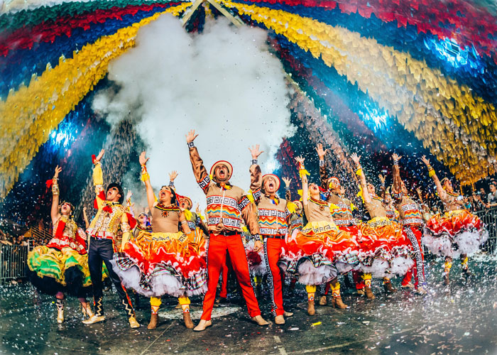 Colorful dressed dancers on the stage during Festa Junina