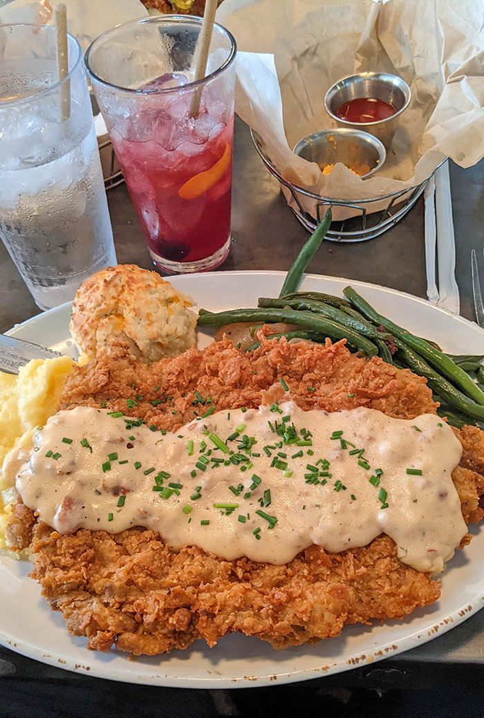 A Slab Of Country-Fried Steak, Mashed Potatoes, Green Beans, And A Cheddar Biscuit. Chef Art Smith's Homecoming In Disney Springs