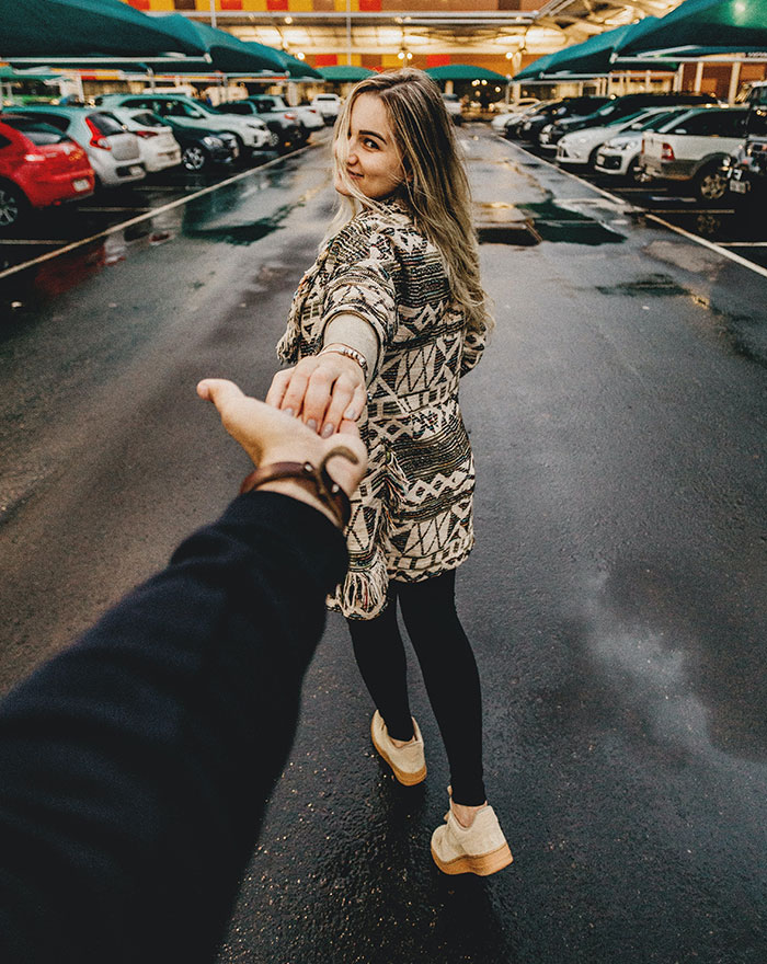 Man holding womans hand