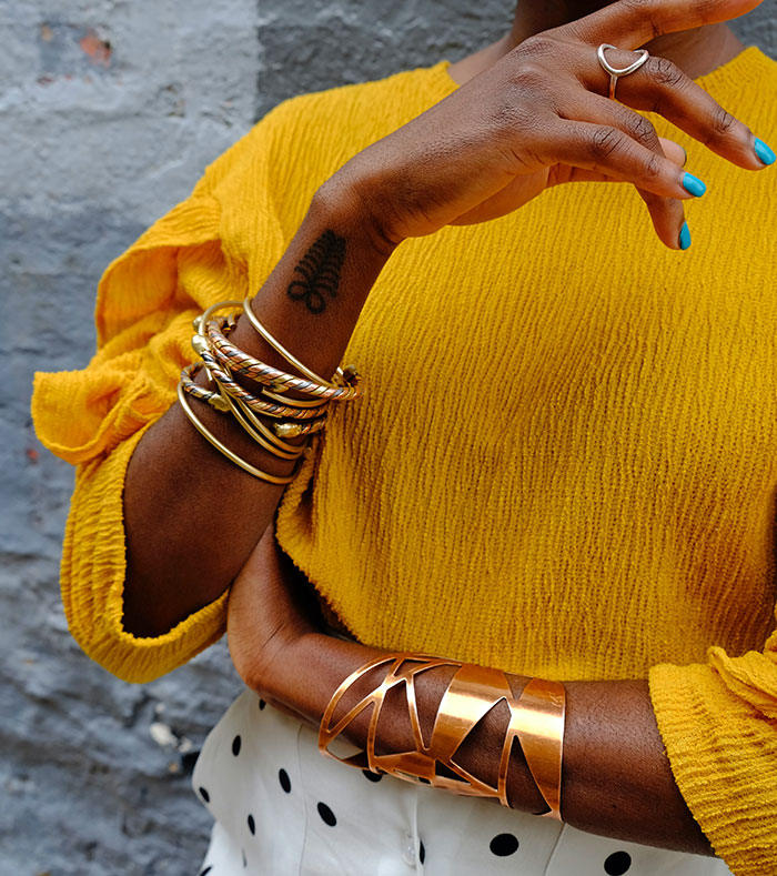 Woman wearing gold bracelets