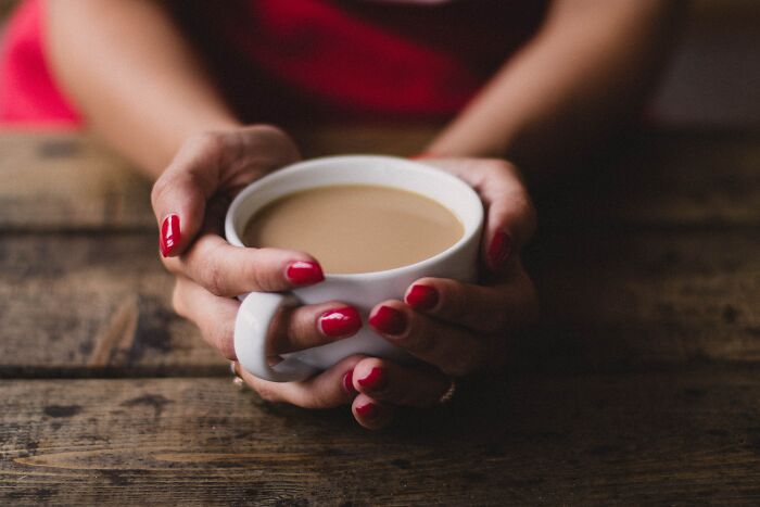 Woman Holding Hot Coffee Cup 
