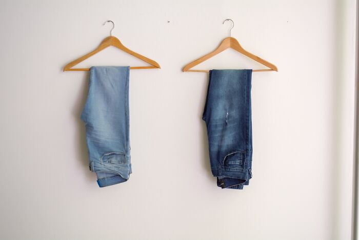Pair Of Jeans Hanging On Hanger 
