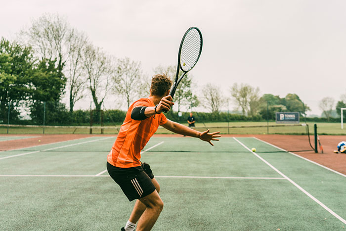 Person playing tennis